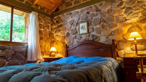 Tempat tidur dalam kamar di Casa de Montaña