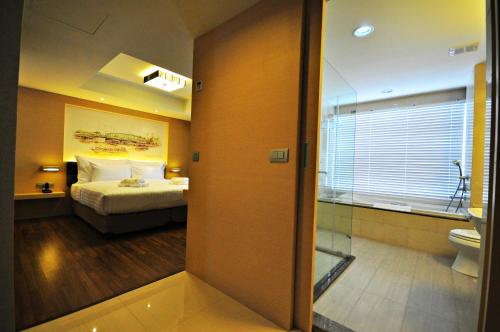 Katil atau katil-katil dalam bilik di Parinda Hotel