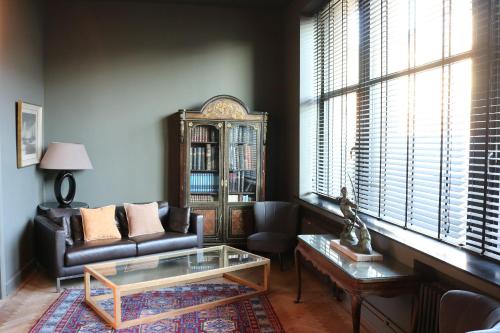 a living room with a couch and a coffee table at Peter House in Nivelles