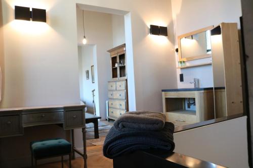 a room with a sink and a desk and a chair at Peter House in Nivelles