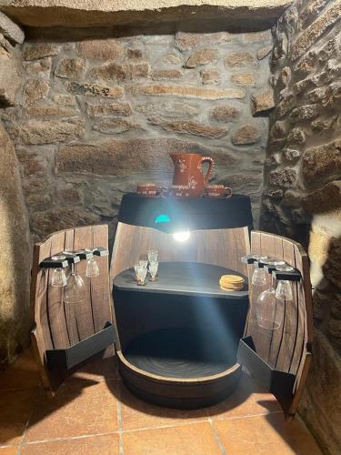 a table in a room with glasses on it at Casa da Aldeia in Azevo