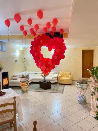 a bunch of red balloons in a living room at B&B Da Felice in Serino