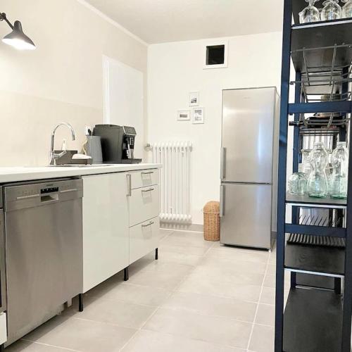 a kitchen with a stainless steel refrigerator in a room at Friends and Family Leiwen in Leiwen