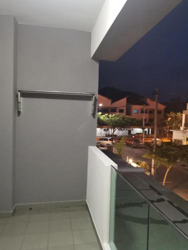 a white door on the side of a building at 48 悠之处NO . 48, PERSIARAN ALAM IMPIAN 3 VILLA RIADAH ALAM IMPIAN PANGKOR, 32300 PANGKOR , PERAK. in Pangkor