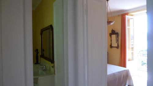 a bathroom with a sink and a mirror at B&B Casa Forster in Cannero Riviera