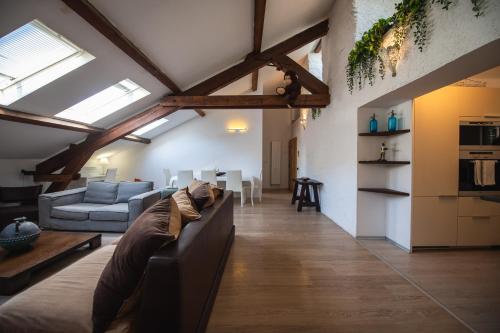 a living room with a couch and a table at V APARTMENTS in Bellinzona