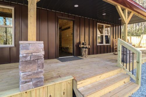 a front porch of a house with a wooden deck at Cozy Bear Cabin #2 in Sautee Nacoochee
