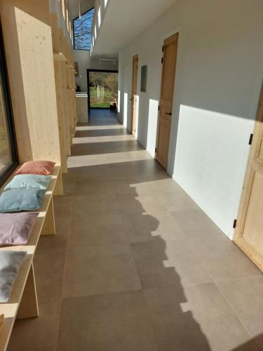 a hallway of a room with beds on shelves at Champs Erezée , genieten in elk seizoen in Érezée