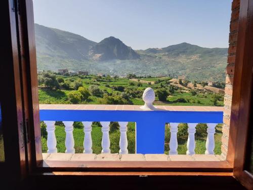 a window with a view of a mountain view at Gite Talassemtane in Chefchaouene