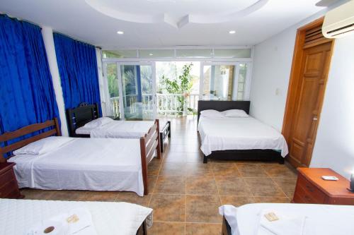 เตียงในห้องที่ Hotel Centro Recreacional y Turístico El Alcaraván