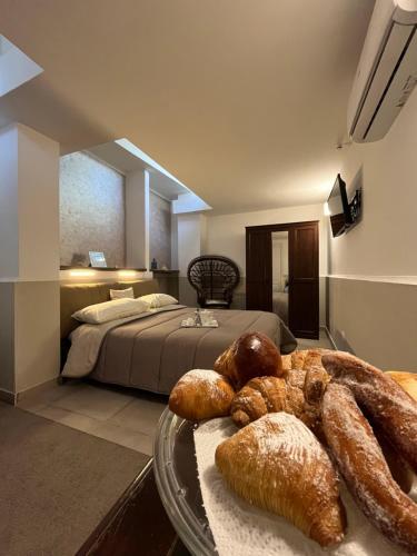 Postel nebo postele na pokoji v ubytování Pompei BnB Maison de Charme