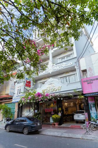 a car parked in front of a building at Window 1 Hotel in Kon Tum