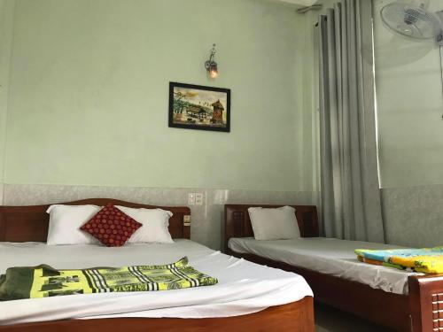 Cama o camas de una habitación en Binh An Hostel