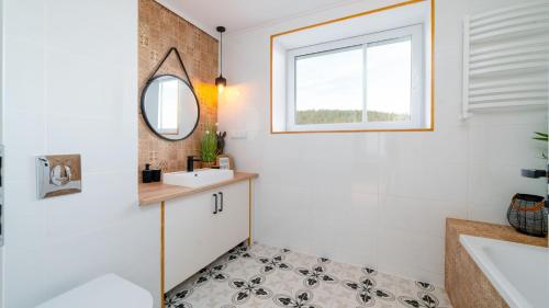 a bathroom with a sink and a mirror at Lux Apartament ,, Górskie Krajobrazy'' Karpacz - Mountain Landscapes in Karpacz