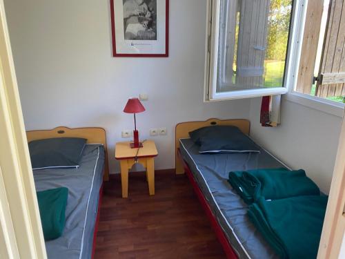 Postel nebo postele na pokoji v ubytování Beau studio rénové pour 4 personnes à Cassen