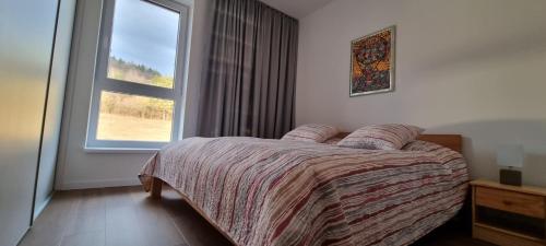 Кровать или кровати в номере Penthouse apartmán Minerál B-4