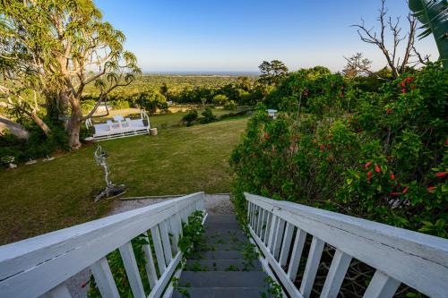 a stairway leading to a yard with a white fence at 302 On Old Sea View Road Chelsea in Port Elizabeth
