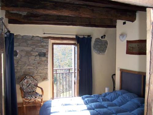 Postel nebo postele na pokoji v ubytování Orbregno Country Houses with Personal Wine Cellar