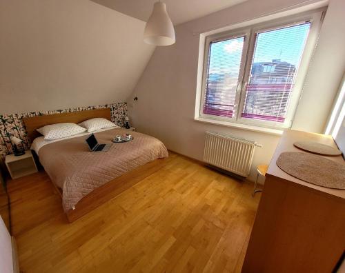 A bed or beds in a room at Gdansk Stogi Beach