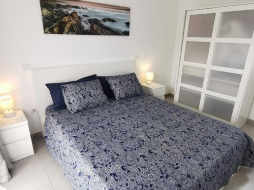 Ένα ή περισσότερα κρεβάτια σε δωμάτιο στο Villaverde Relax 2 a 10 minutos de Corralejo