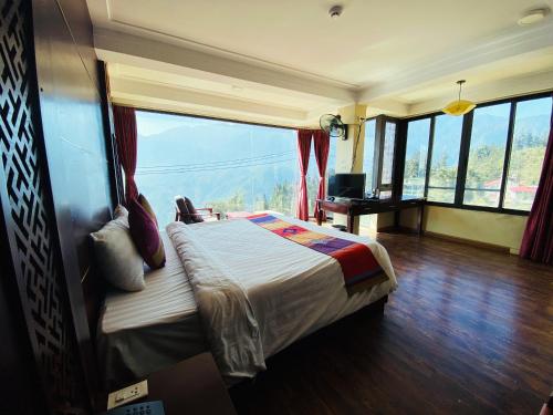 Ένα ή περισσότερα κρεβάτια σε δωμάτιο στο Sapa Vista Hotel