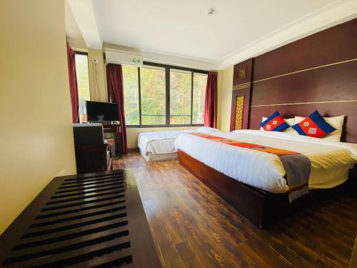 Ένα ή περισσότερα κρεβάτια σε δωμάτιο στο Sapa Vista Hotel