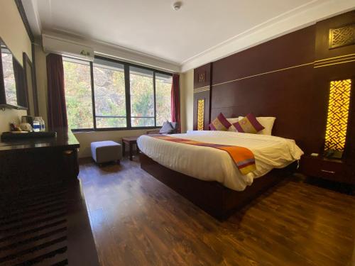 Ένα ή περισσότερα κρεβάτια σε δωμάτιο στο Sapa Vista Hotel