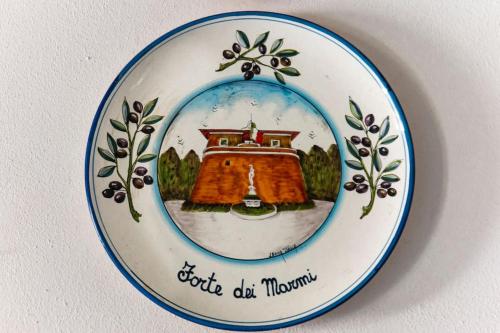 a plate with a picture of a house on it at Villa Vanna - the ancient Forte just in the center in Forte dei Marmi