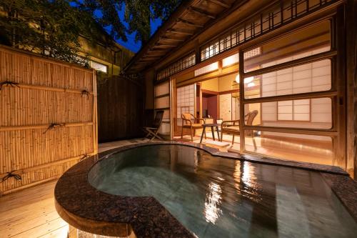 a swimming pool in the backyard of a house at Okutsusou in Kagamino