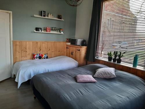 Katil atau katil-katil dalam bilik di De Herberg