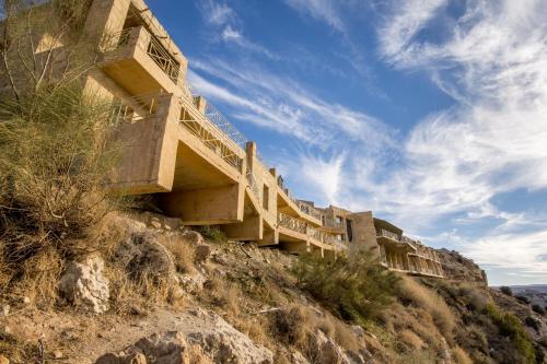 a building on the side of a hill at Dana Guesthouse in Dana