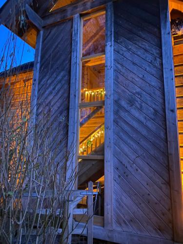 a house with lights in the window at Pandy B&B in Dorstone