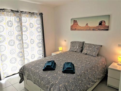 Postel nebo postele na pokoji v ubytování Villaverde Relax 1 a 10 minutos de Corralejo