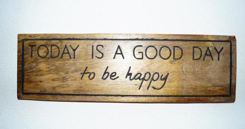 a sign that reads today is a good day to be happy at Bergkristall Apartments in Ischgl