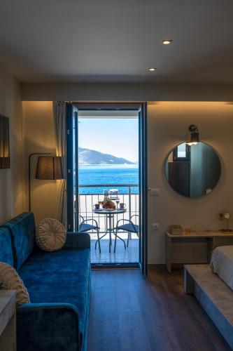 a living room with a couch and a view of the ocean at SAMI BAYVIEW in Sami