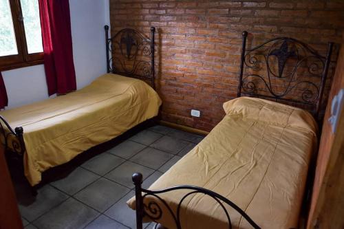 Ένα ή περισσότερα κρεβάτια σε δωμάτιο στο La Quebrada Apartamentos