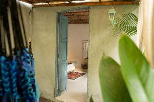 an open door to a room with a room with at Ekaa Hotel in Palomino