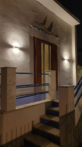 a staircase leading to a building at night at Le Vele Mondello, villa a due passi dal mare in Mondello
