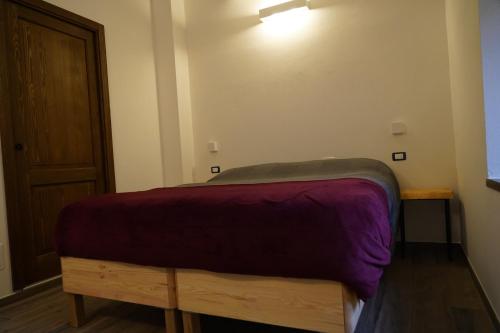 Postel nebo postele na pokoji v ubytování Mulino delle Cortine
