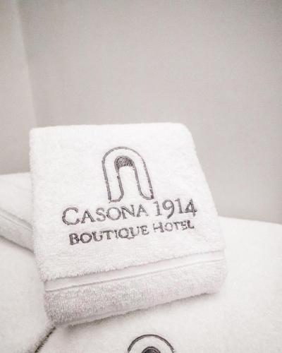 a towel on top of a pile of towels at Boutique Hotel in Quito Hotel Casona 1914 in Quito