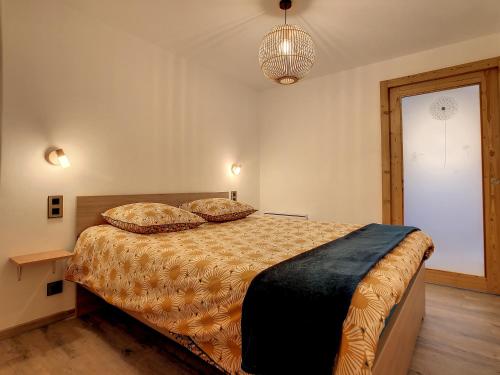 Säng eller sängar i ett rum på Mont Alt, F2 40m2 en rdc, calme, Vue Mt Blanc