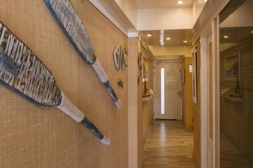 a hallway with three baseball bats on the wall at Juan Dolio Costa del Sol in Juan Dolio