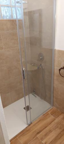 a shower with a glass door in a bathroom at Casa Roberta Fuego in Arona