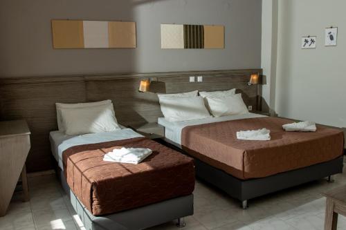 Ένα ή περισσότερα κρεβάτια σε δωμάτιο στο Anna Katerina Apartments
