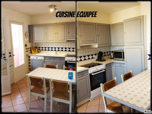 een keuken met witte kasten en een tafel met stoelen bij appartement du pecheur in Valras-Plage