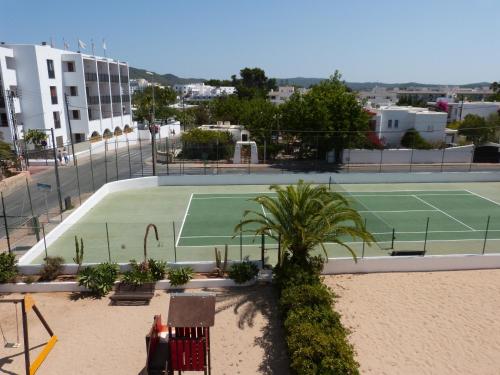 a tennis court in the middle of a city at Hotel Osiris Ibiza in San Antonio