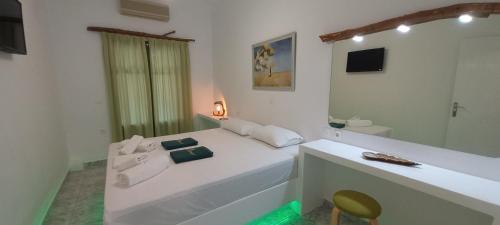 A bed or beds in a room at Leros Eleonas Apartments