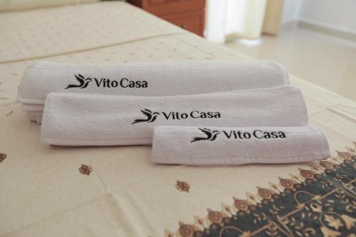 three towels sitting on a table in a bathroom at Magnifique Villa Avec Piscine, Pour Vos Vacances ! in Monastir
