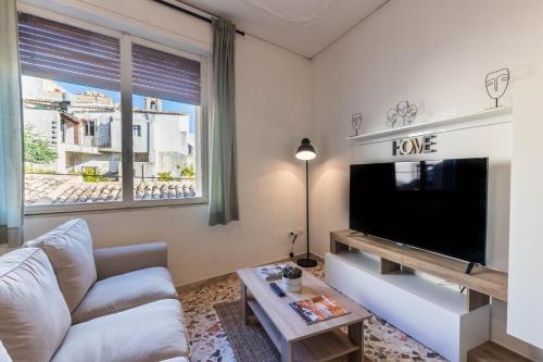 A television and/or entertainment centre at Trigona 4 Apartment