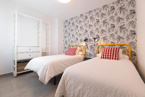 Cama o camas de una habitación en Sol de Sanlúcar Ático centro Parking incluido